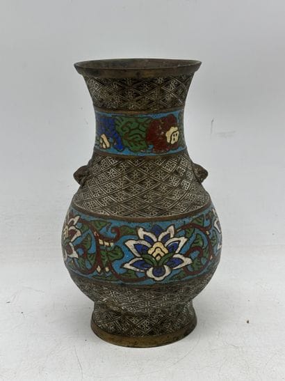 Patinated bronze baluster vase with two lion...