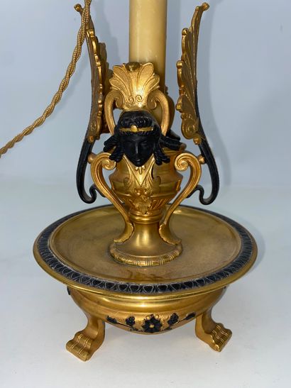 Gilt bronze and brown patina bronze candlestick,...