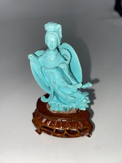 CHINA Set of three turquoise statuettes representing...