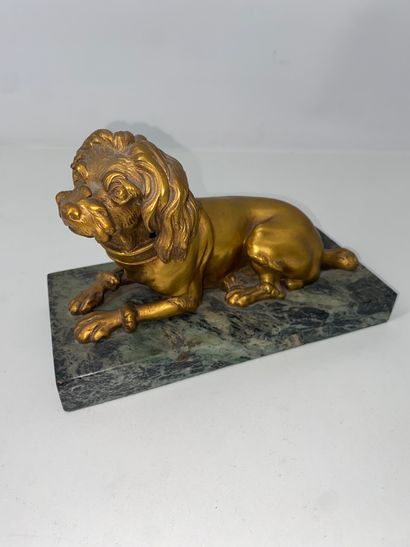 Gilded bronze paperweight of a dog lying...