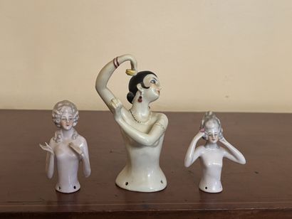 Three polychrome porcelain busts of women...
