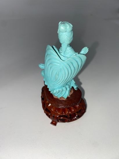 CHINA Set of three turquoise statuettes representing...