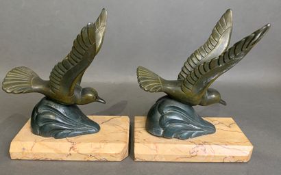 Pair of bookends in patinated metal on a...