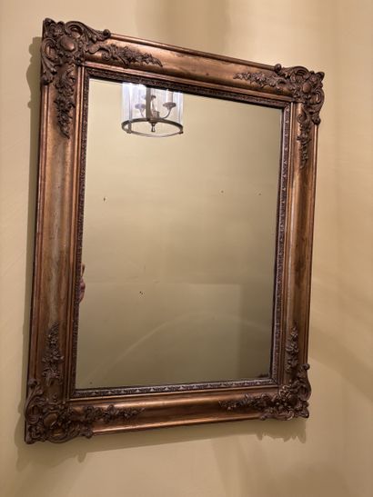 Rectangular mirror in gilded stuccoed wood...