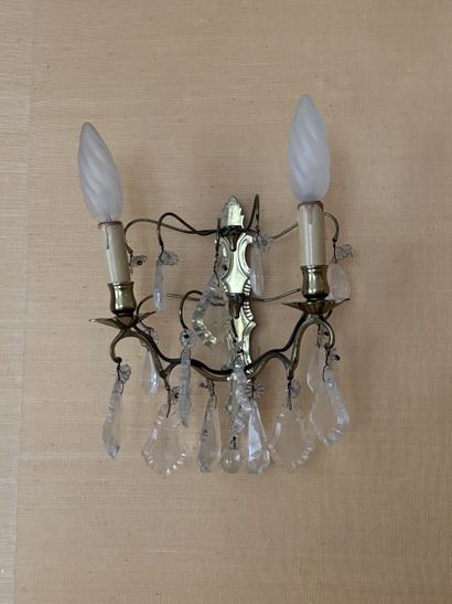 Four two-arm gilt-metal sconces with pendants...