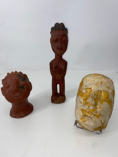 Funerary mask in partially yellow enameled...