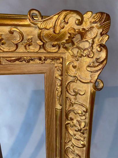Carved and gilded wood frame, Louis XV style....