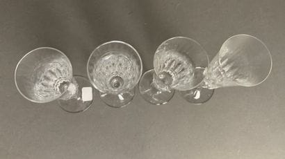 BACCARAT Four cut-crystal champagne flutes,...