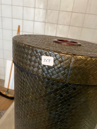 Cylindrical, woven and stained laundry basket....