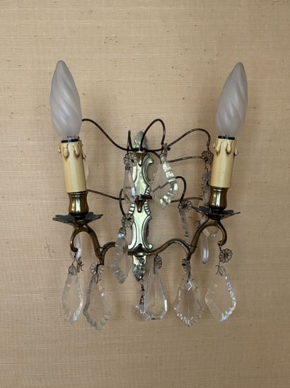 Four two-arm gilt-metal sconces with pendants...