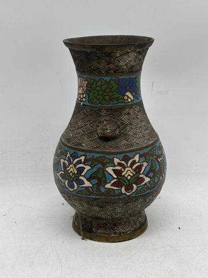 Patinated bronze baluster vase with two lion...