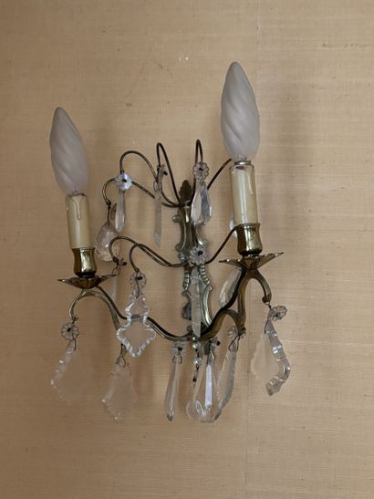 Four two-arm gilt-metal sconces with pendants...