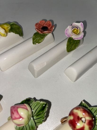 Suite of two sets of 6 ceramic knife-holders...