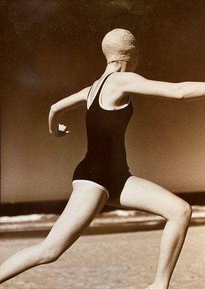 Modern school Swimmer exercising on the beach...