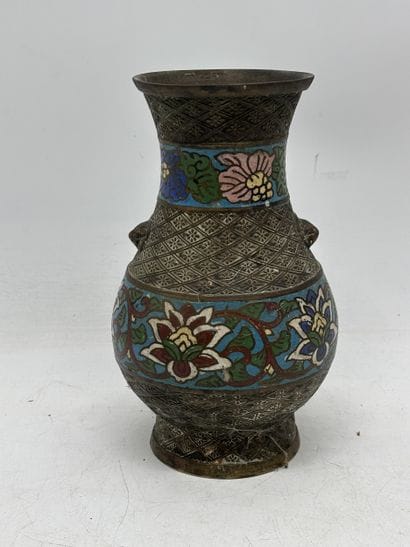 Patinated bronze baluster vase with two lion...