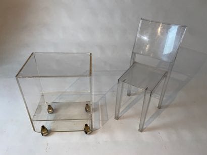 Plexiglass television table, mounted on castors....