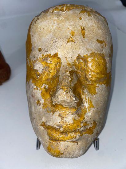 Funerary mask in partially yellow enameled...