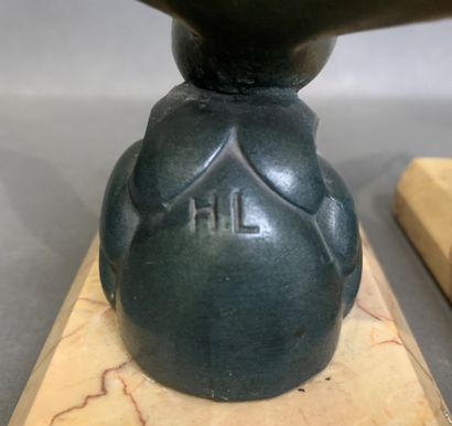 Pair of bookends in patinated metal on a...