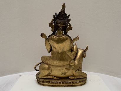 Divinité bouddhiste assise sur un buffle...