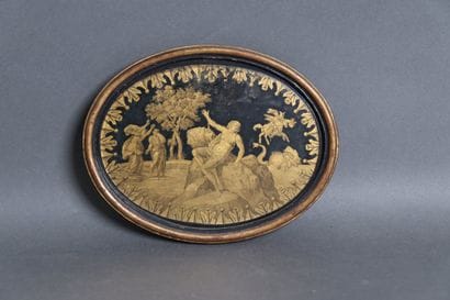 Oval cardboard panel with an engraved design...