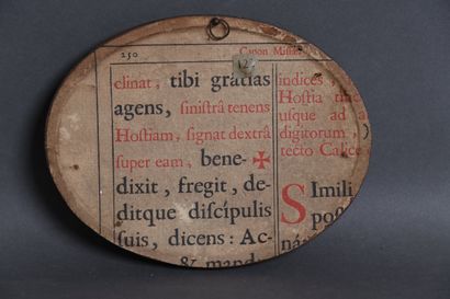 Oval cardboard panel with an engraved design...