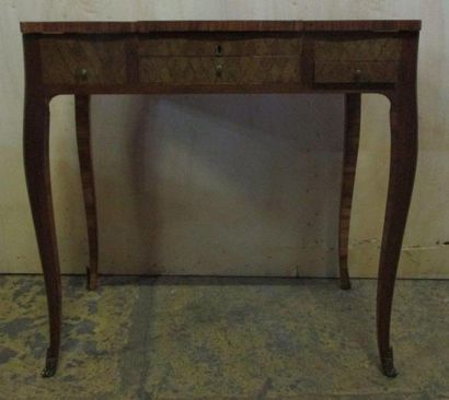 Coiffeuse en bois de placage à décor de trophés...