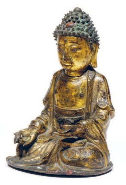 Sujet en bronze doré représentant le Bouddha...