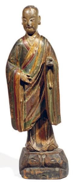 Statuette en bois laqué représentant un moine...