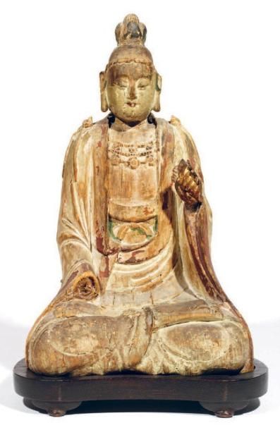 Statuette en bois anciennement laqué représentant...