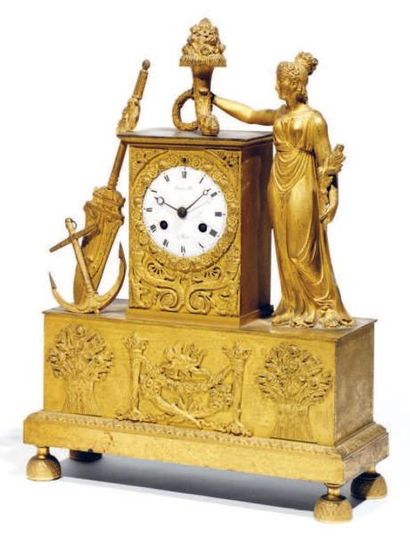 Pendule borne en bronze ciselé et doré, le...