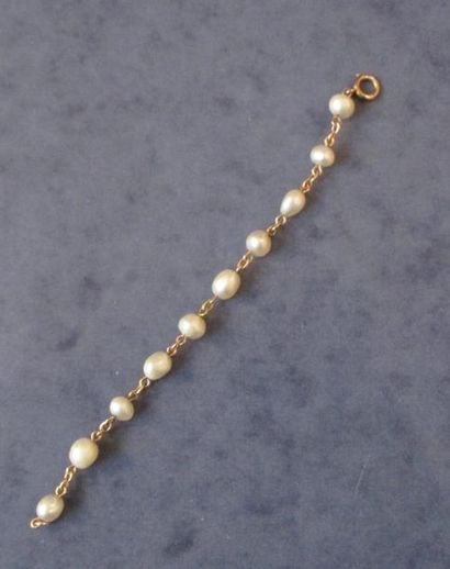 Bracelet articulé en or jaune 18K orné de...