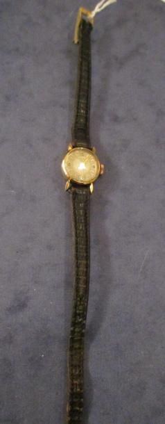 Montre de femme en or jaune 18k°, bracelet...