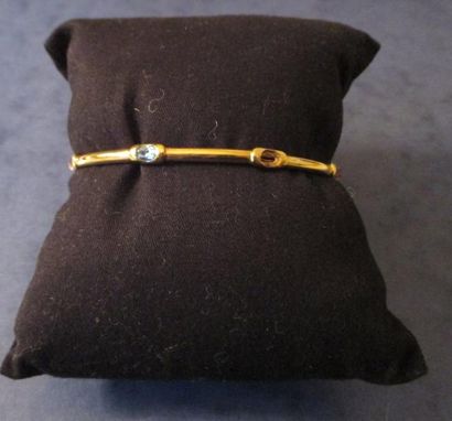 Bracelet articulé en or jaune 18 k et pierres...