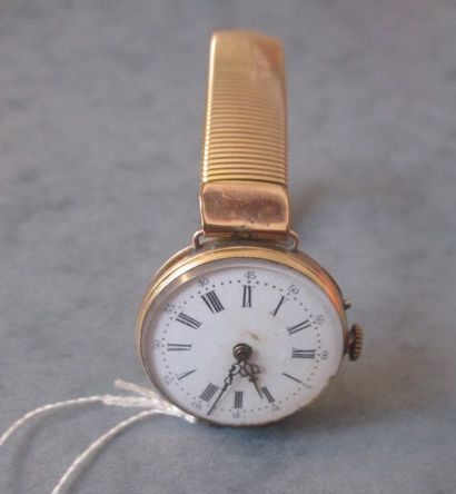 Une montre en or jaune 18 k bracelet en métal,...