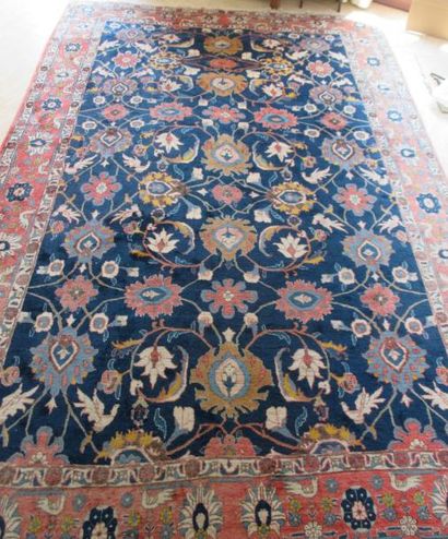 Tapis fond bleu décor de fleurs broderie...