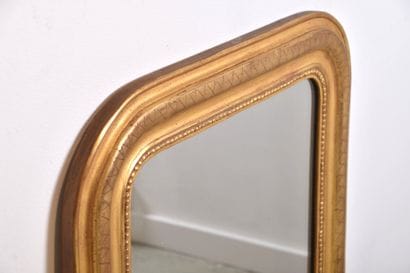 Miroir Louis Philippe, en bois doré décor...