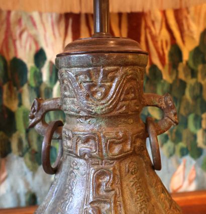 Lamp consisting of a vase-shaped body in...