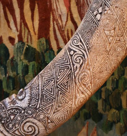 Bone engraved with multiple geometric motifs,...