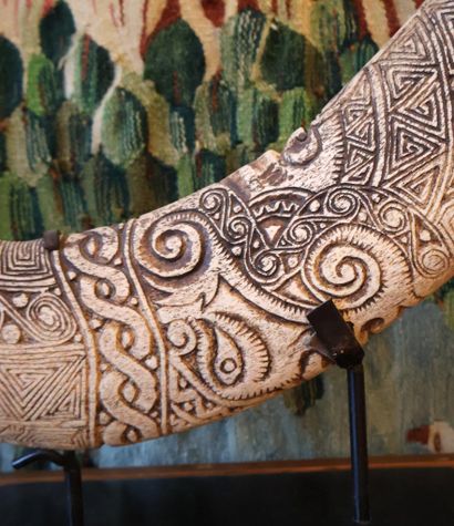 Bone engraved with multiple geometric motifs,...