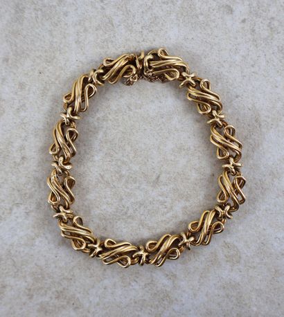 Bracelet en or jaune 18K 750/1000 triplement...