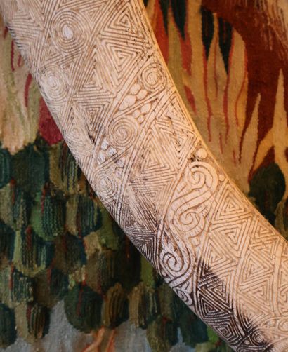 Bone engraved with multiple geometric motifs,...