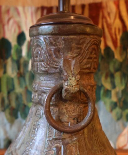 Lamp consisting of a vase-shaped body in...