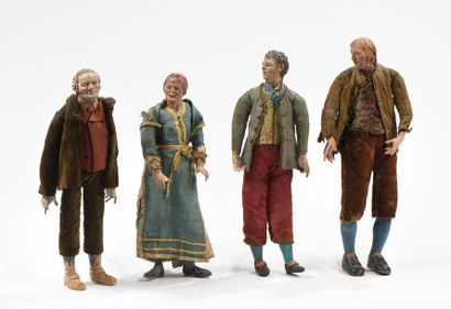Série de quatre personnages en bois et terre-cuite...