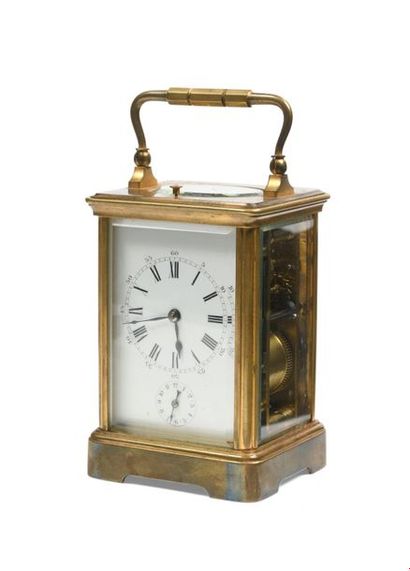 Pendulette d'officier en bronze et verre...