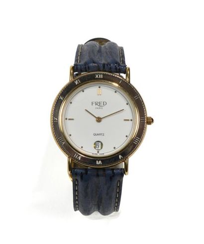FRED.
Montre de dame en acier et métal doré,...