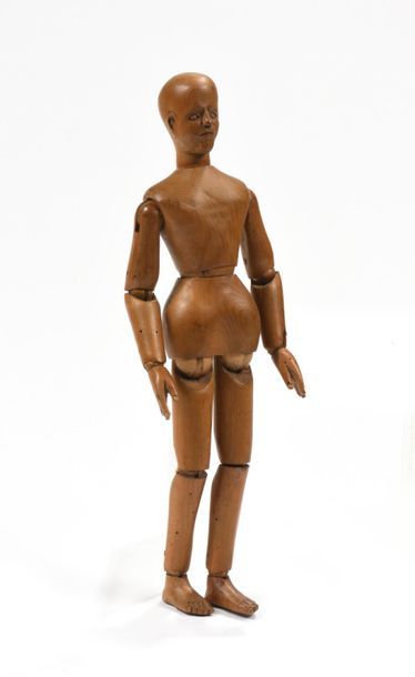 Petit mannequin d'étude en bois blanc articulé.
Fin...