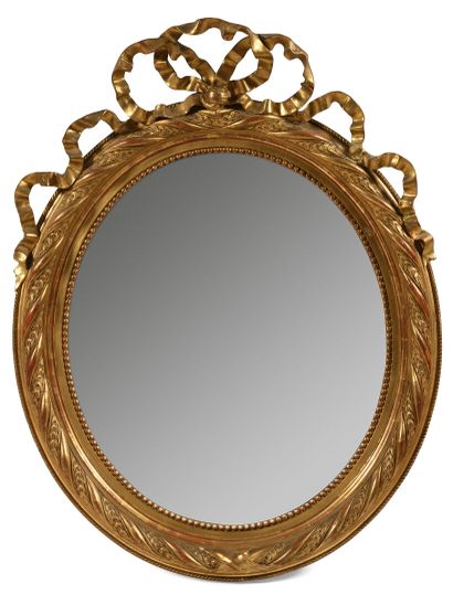Oval mirror in molded wood, stuccoed and...
