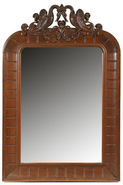 Molded and carved oak mirror, the upper part...