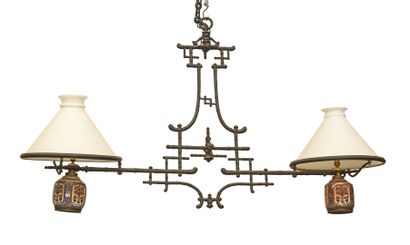 * Hanging billiard table with two lamps in...