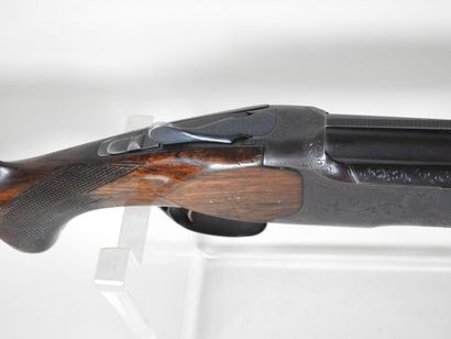 MIROKU brand shotgun with stacked 20 gauge...